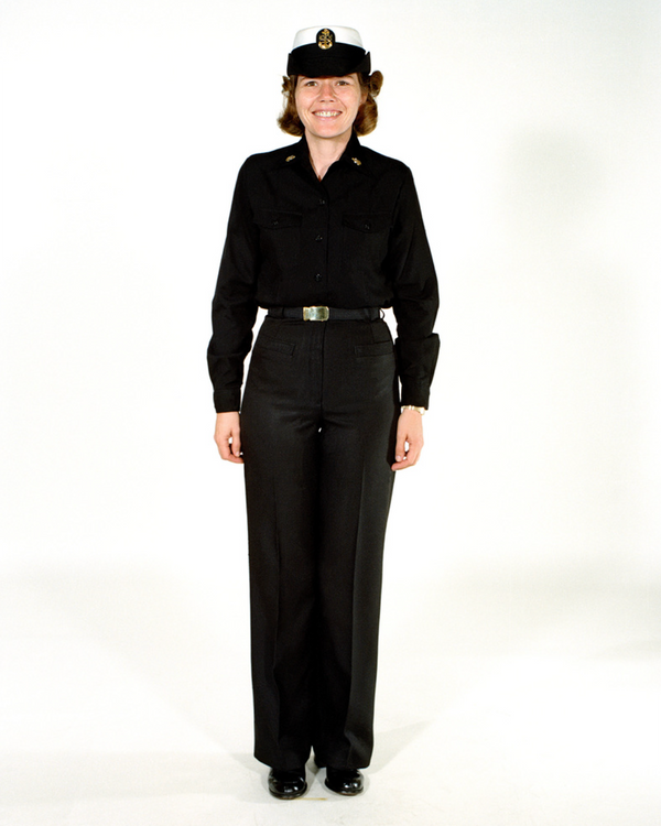 Navy Female CPO Winter Working Blue Uniform worn with white combination cover.