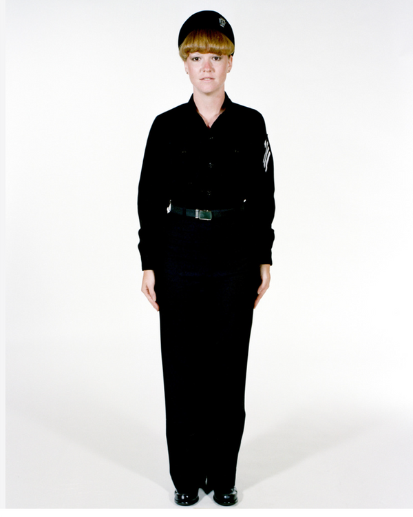 Navy Female Enlisted E6 & Below Winter Working Blue Uniform worn with beret.