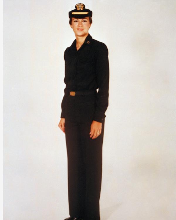 Navy Female Officer Winter Working Blue Uniform worn with white combination cover.
