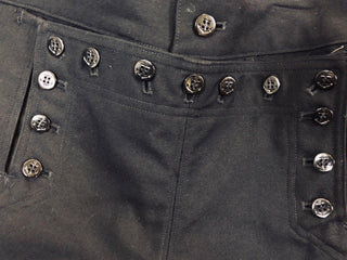Front "broadfall" flap with 13 button closure