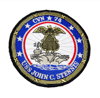 US Navy Military Aircraft Carrier Patch. The U.S.S. John C. Stennis (CVN-74) is the seventh Nimitz-class nuclear-powered supercarrier in the United States Navy, named for Senator John C. Stennis of Mississippi.  - Round embroidered patch - Measures: 5 x 5 inches - Embroidered twill; Merrowed edge - Colors: Blue, red, white, gray with yellow gold & black border - Authentic, Official US Military Patch - Condition: Good, pre-owned/gently used unless marked as NEW.