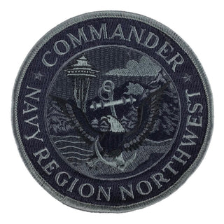 USN Military Patch - Commander Navy Region Northwest (CNRNW). Navy Region NW was renamed Naval Base Seattle in 1980 and subsequently renamed Navy Region Northwest in February 1999.  - Round embroidered patch - Measures: 4 x 4 inches - Embroidered twill; Merrowed edge - Colors: navy blue & gray - Authentic, Official US Military Patch - Condition: Good, pre-owned/gently used unless marked as NEW.