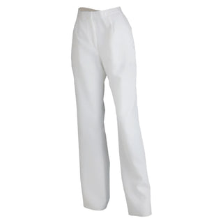 US Navy Female Service Dress White (SDB) Unbelted Jumper Pants. These slacks are worn by enlisted sailors with the Ladies White Jumper Top with Piping & Zipper, or plain White Jumper Top. Unbelted waistband with zippered front closure, and two side pockets. Official Military Issue Uniform. White CNT (Certified Navy Twill) 100% Polyester. Made in U.S.A.