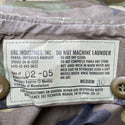 Label: Orc Industries, Inc. BDU Woodland Camo Wet Weather Parka/Improved Rainsuit. NSN 8405-01-443-9622. Date of Manufacture 02/05. Size: Medium.