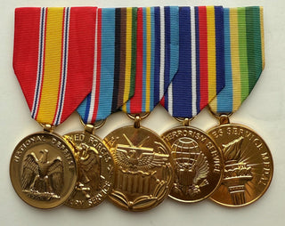 Genuine U.S. Military Armed Forces Medal Rack Set. Set includes Regulation Full Size Anodized Medal Rack (l-r):
1. National Defense Service Anodized Medal
2. Armed Forces Expeditionary Anodized Medal
3. Global War on Terrorism Expeditionary Anodized Medal
4. Global War on Terrorism Service Anodized Medal
5. Armed Forces Service Anodized Medal- Mounting bar included.
- Official U.S. Military Grade Medals
- Made in the USA