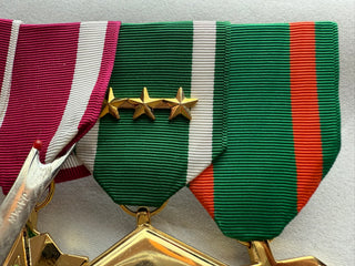 Genuine U.S. Military Armed Forces Medal Rack Set;
- Set includes Regulation Full Size Medals (l-r):
Defense Meritorious Service Anodized Medal
Meritorious Service Anodized Medal
Navy & Marine Corps Commendation Anodized Medal with 3 bronze stars
Navy & Marine Corps Achievement Anodized Medal

- Mounted on bar
- Official U.S. Military Grade Medals
- Made in the USA