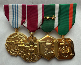 Genuine U.S. Military Armed Forces Medal Rack Set;
- Set includes Regulation Full Size Medals (l-r):
Defense Meritorious Service Anodized Medal
Meritorious Service Anodized Medal
Navy & Marine Corps Commendation Anodized Medal with 3 bronze stars
Navy & Marine Corps Achievement Anodized Medal

- Mounted on bar
- Official U.S. Military Grade Medals
- Made in the USA
