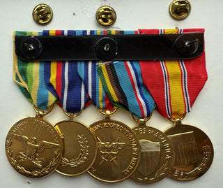 Genuine U.S. Military Armed Forces Medal Rack Set. Set includes Regulation Full Size Anodized Medal Rack (l-r):
1. National Defense Service Anodized Medal
2. Armed Forces Expeditionary Anodized Medal
3. Global War on Terrorism Expeditionary Anodized Medal
4. Global War on Terrorism Service Anodized Medal
5. Armed Forces Service Anodized Medal- Mounting bar included.
- Official U.S. Military Grade Medals
- Made in the USA