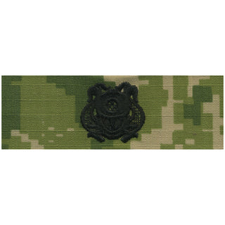 NAVY NWU Type III Badge: Diver 1st Class. US NAVY Working Uniform Type 3 Embroidered Badge - Diver First Class.  Official U.S. Navy tag to be used with NWU Type III Uniform. USN Certified. Black Embroidery on Green Woodland Digital Camouflage. Nylon Cotton Ripstop. Made in the U.S.A.