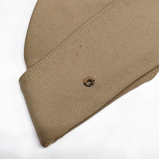 NAVY Women's Khaki CNT Garrison Cap - Retired. US NAVY Vintage Female Khaki Garrison Cap in Polyester CNT (Certified Navy Twill). The Khaki CNT cover is a retired style, paired with older USN uniforms made of the same material. Women's style features a curved, streamlined shape. Some older styles include a metal grommet vented front design.