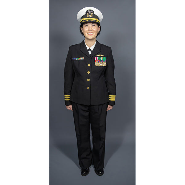 U.S. Navy Female Officer Commander (CDR) O-5 in ceremonial full dress blue uniform