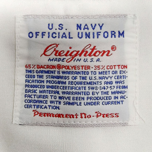 US NAVY Male White Long Sleeved Dress Shirt with NO Epaulets. Creighton brand label. U.S. NAVY OFFICIAL UNIFORM. White 65% Dacron Polyester, 35% Cotton. Made in U.S.A. Permanent No-Press