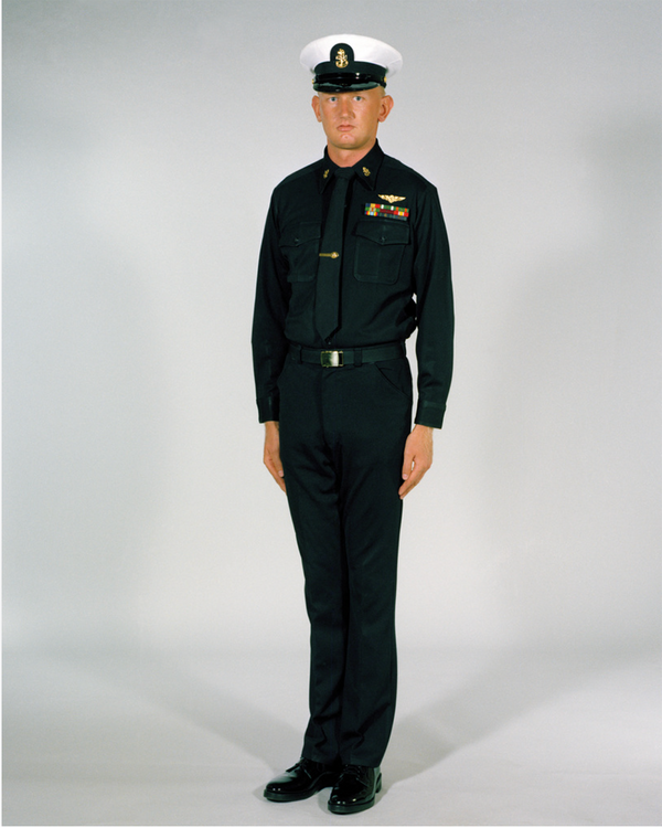 Navy CPO Winter Service Blue Uniform worn with white combination dress cap cover, black neck tie, ribbons & badges.