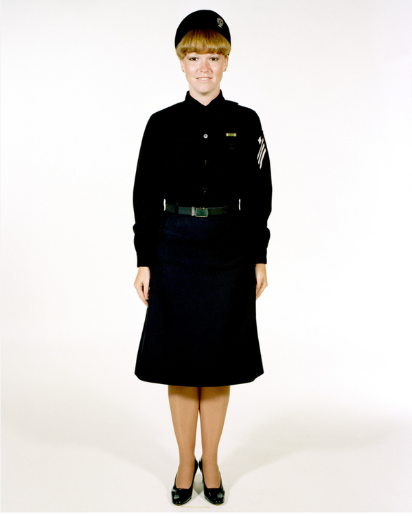 Navy Female Enlisted E6 & Below Winter Service Blue Uniform worn with skirt, necktab, beret and ribbons.