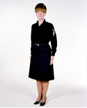 Navy Female Enlisted E6 & Below Winter Working Blue Uniform worn with skirt and beret.