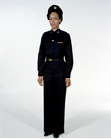 Navy Female Officer Winter Service Blue Uniform worn with necktab, beret, ribbons and badges.