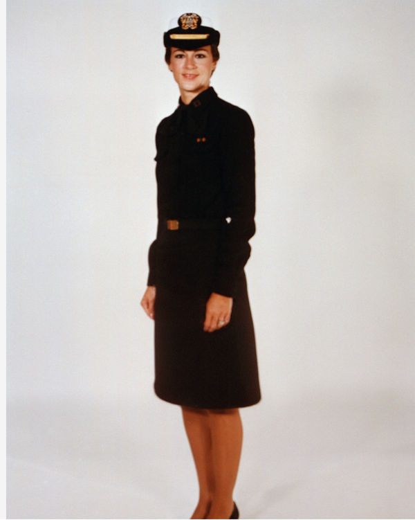 Navy Female Officer Winter Service Blue Uniform worn with skirt, white combination cover, necktab & ribbons.