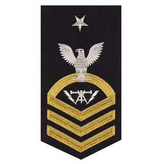 NAVY Men's Rating Badge: E8 Fire Controlman - Seaworthy Gold on Blue. USN Male Rating Badge: E-8 Fire Controlman (FCC) - Standard Seaworthy Gold on Blue for Service Dress & Dinner Dress Blue uniform. Gold chevrons indicate 12 years of consecutive good conduct. CPO embroidered Regulation Gold Chevron on Blue with White Eagle and Designator. Gold & White Embroidery on Dark Blue Polyester Wool. US Navy Certified. Made in the USA.