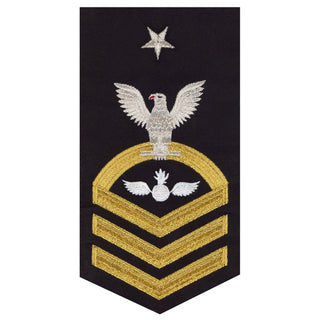 USN Male Rating Badge: E-8 Aviation Ordinanceman (AO) - Standard Seaworthy Gold on Blue for Service Dress & Dinner Dress Blue uniform. Gold chevrons indicate 12 years of consecutive good conduct.  - CPO embroidered Regulation Gold Chevron on Blue with White Eagle and Designator.  - Gold & White Embroidery on Dark Blue Polyester Wool. - US Navy Certified - Made in the USA