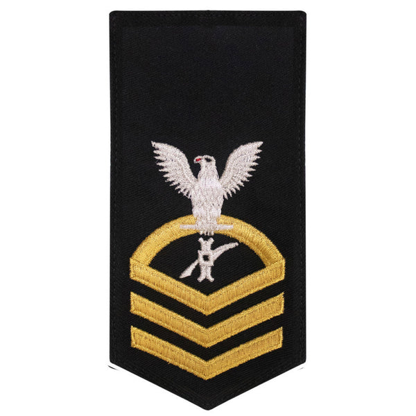 USN Female Rating Badge: E-7 Legalman (LN) - Standard Seaworthy Gold on Blue for Service Dress & Dinner Dress Blue uniform. Gold chevrons indicate 12 years of consecutive good conduct.  - CPO embroidered Regulation Gold Chevron on Blue with White Eagle and Designator.  - Gold & White Embroidery on Dark Blue Polyester Wool. - US Navy Certified - Made in the USA