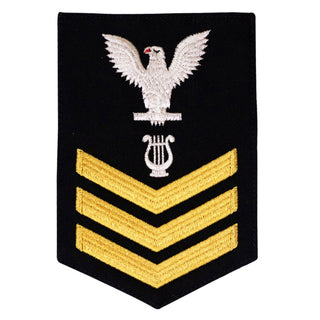 USN Male Rating Badge: E6 Musician (MU) - Standard Seaworthy Gold on Blue for Enlisted Service Dress & Dinner Dress Blue uniform. Gold chevrons indicate 12 years of consecutive good conduct.  - Fabric: Gold & White Embroidery on Dark Blue Wool Serge. - US Navy Certified - Made in the USA