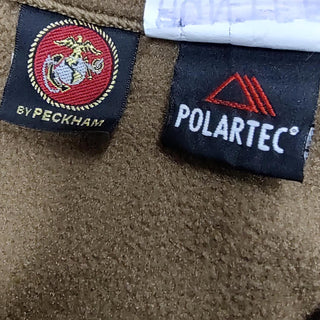Clothing labels for USMC Coyote Half-Zip Pullover Fleece Jacket. US Marine Corps Cold Weather Pullover in brown coyote Polartec fleece. Made in the U.S.A. by Peckam for the United States Marine Corps.