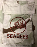 Embroidered "Seabees" insignia of fighting bee logo embroidered in coyote brown thread on the left chest pocket of Military DCU Tri-Color Tan Desert Camouflage Blouse. Made in U.S.A.