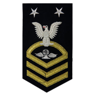 USN Male Rating Badge: E-9 Aviation Traffic Controller (AC) - Seaworthy Gold on Blue for Dress Blue & Dinner Dress Blue uniform. MCPO embroidered Regulation Gold Chevron on Blue with White Eagle and Designator. Gold Chevrons Indicating Good Conduct Service.  - Fabric: Silver White & Gold Embroidery on Dark Blue Wool - Quality = Seaworthy/ Standard - US Navy Certified - Made in the USA - Condition: Good, pre-owned/gently used unless marked as NEW.