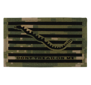 (NWU) Navy Working Uniform Type 3 Velcro Patch "Don't Tread On Me." NOTE: DO NOT Wash. Official U.S. Navy Shoulder Patch to be used with NWU Type III Uniform, digital green camouflage.   - Laser-cut green digital camo fabric on black with Velcro backing. - Measures approximately 2 1/8" x 3 5/8". - Care: DO NOT Wash. - Worn by Official US Navy personnel. - Made in the USA. - Condition: Good, pre-owned/gently used unless marked as NEW.