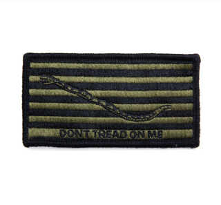 US NAVY Type III Embroidered Shoulder Patch - Don't Tread on Me. Worn on left sleeve shoulder pocket of Type 3 NWU Woodland blouse. Features velcro hook & loop backing.  - USN Certified - Measures: approx 4 x 2.2 inches - Sold individually - Made in the U.S.A. - Authentic, Official US Military Patch - Condition: Good, pre-owned/gently used unless marked as NEW.