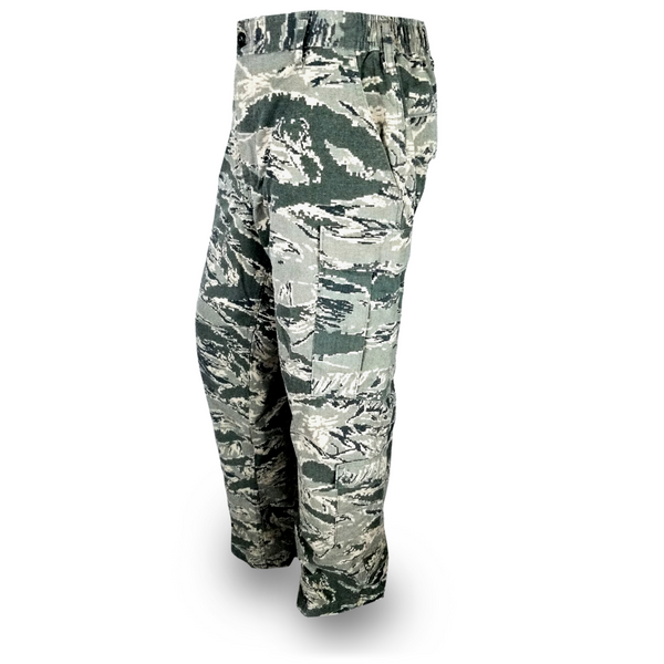  USAF Men ABU DTS Trousers. US Air Force Male Airman Battle Uniform Pants in Cotton-Nylon Twill or Ripstop. Part of USAF Airman Battle Uniform (ABU) formerly worn by United States Air Force Airmen from 2007-2021. This camo is also known as Digital Tiger Stripe. Features a Button-Fly, 2 Slash Front Pockets, 2 Button-Flap Back Pockets, and 2 Side Cargo Pockets on each leg. Camo colors tan, gray, sage green & slate blue. Genuine, Official Military USAF Airman Battle Uniform. Made in the U.S.A.