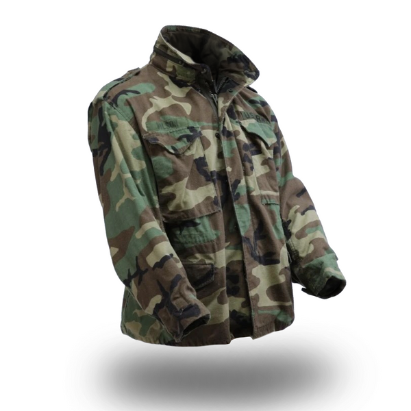 M65 BDU Woodland Field Jacket. U.S Military M-65 Battle Dress Uniform Woodland Camo Field Coat. This Cold Weather Field Coat is a classic outerwear jacket in the BDU woodland camouflage pattern. Features a heavy duty front zipper closure with snap storm-flap, 2 front snap chest pockets, 2 snap waist pockets, and shoulder epaulets. 50/50 Cotton/Nylon. Genuine Military-issue uniform. Made in the U.S.A.