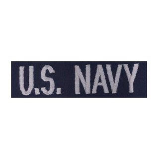 USN "U.S. NAVY"  in silver embroidery for Enlisted E1-E6. Worn on the Navy Working Uniform Utility Coveralls.  - USN Certified - Silver white embroidery on blue. - Made in U.S.A. - Condition: Good, pre-owned/gently used unless marked as NEW.
