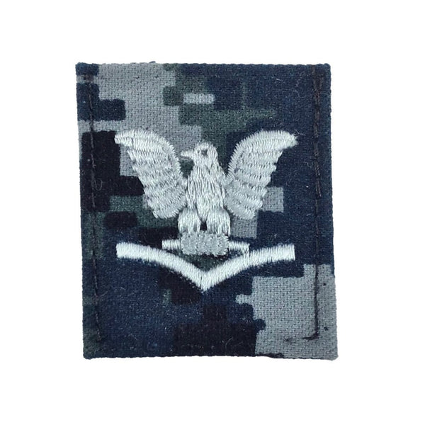 NAVY NWU Type I Cap Device - E4. US NAVY Working Uniform Type 1 Cap Device - E-4 Petty Officer Third Class (PO3). Silver embroidery on Blueberry Camo. Official U.S. Navy patch worn on the NAVY NWU Type I 8-Point Cover. Digital Blue Camouflage (retired in October 2019). USN Certified. 50% Nylon / 50% Cotton Twill. Made in the USA.