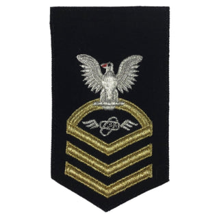 USN Female Rating Badge: E7 Aviations Electronics Technician (AT) - Seaworthy Gold on Blue for Dress Blue & Dinner Dress Blue uniform. CPO embroidered Regulation Gold Chevron on Blue with White Eagle and Designator. Gold Chevrons Indicating Good Conduct Service.  - Fabric: Silver White & Gold Embroidery on Dark Blue Wool - Quality = Seaworthy/ Standard - US Navy Certified - Made in the USA - Condition: Good, pre-owned/gently used unless marked as NEW.