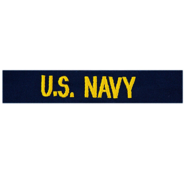 USN "U.S. NAVY"  gold embroidery for CPOs & Officers (E7-O10). Worn on the Navy Working Uniform Utility Coveralls.  - USN Certified - Gold yellow embroidery on blue. - Made in U.S.A. - Condition: Good, pre-owned/gently used unless marked as NEW.