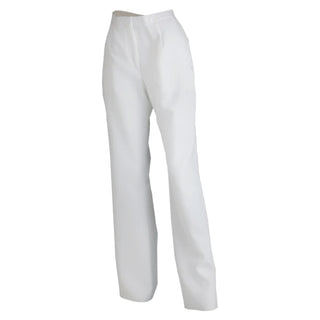 AS-IS Condition US Navy Female Service Dress White (SDB) Unbelted Jumper Pants. These slacks are worn by enlisted sailors with the Ladies White Jumper Top with Piping & Zipper, or plain White Jumper Top. Unbelted waistband with zippered front closure, and two side pockets. Official Military Issue Uniform. White CNT (Certified Navy Twill) 100% Polyester. Made in U.S.A.