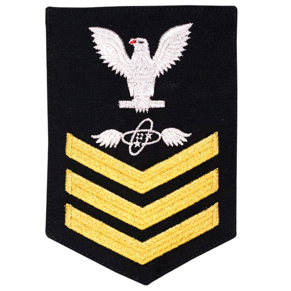 USN Male Rating Badge: E6 Aviation Electronics Technician (AT) - Standard Seaworthy Gold on Blue for Enlisted Service Dress & Dinner Dress Blue uniform. Gold chevrons indicate 12 years of consecutive good conduct.
