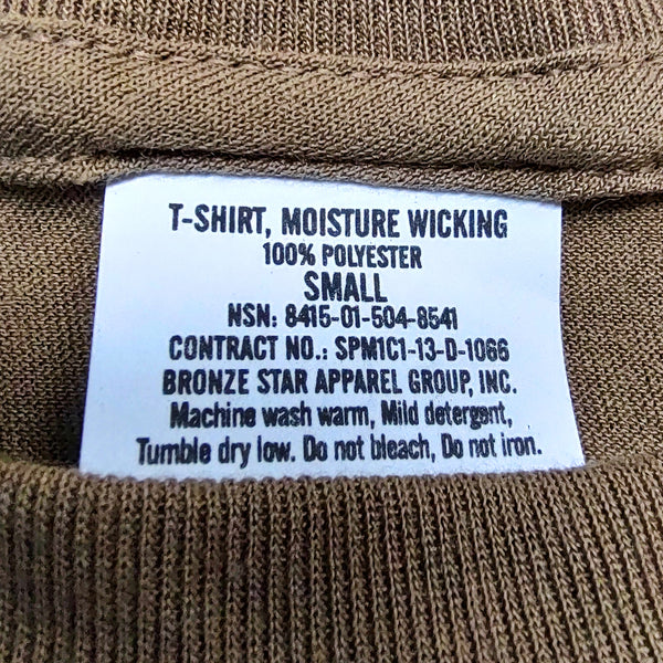 Military Undershirt in Coyote Brown. T-Shirt base layer approved to wear with US Navy Type III Uniform (AO2 Woodland Digital Camo). Features a crew neck bound-stick neckline, form fitted with double-needle hem, and moisture-wicking/dry performance technology.  - Sold individually - Fabric: Coyote Brown 100% Polyester Knit